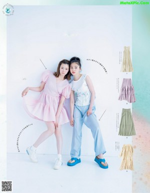 A magazine spread with two young women posing for a picture.